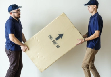 Men carrying a box